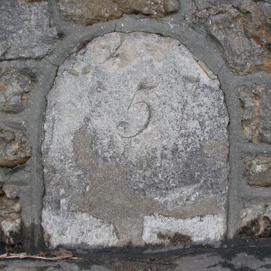 Milestone, Bridport; 10M S of turning to Knightstone Rise.