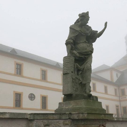 Statue of the allegory of Pile on the terrace of the hospital in Kuks