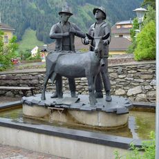 Brunnen mit Skulptur Der Goashandel