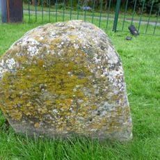 Milestone, S end of village 30m E of sharp bend, by village Hall