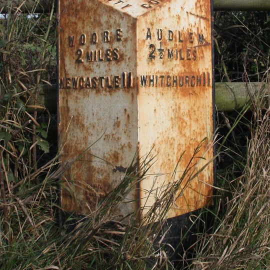 Milepost, W of entrance to The Grange