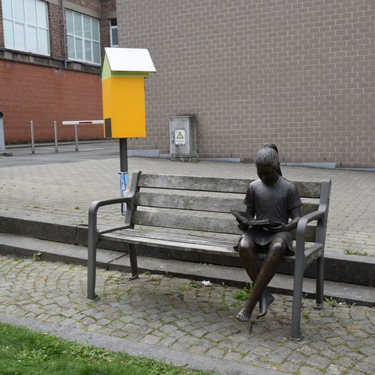 Girl reading on a bench