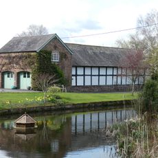 Building housing swimming pool (formerly barn) in garden of Manor Farm