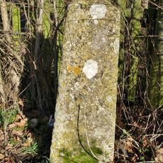 Milestone, by gate to avenue