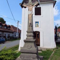 Cross in front of the bell tower in Přeckov