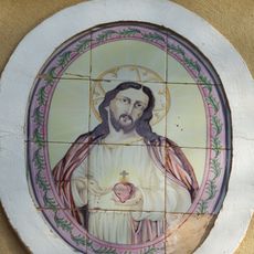 Ceramic panel of the Sacred Heart at Marià Puig street