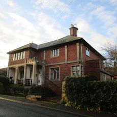 May Tree House With Adjoining Steps And Boundary Wall