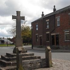 Village cross and stocks