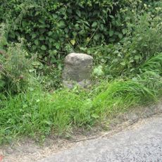 Milestone, Calne Road, S of new roundabout, between jct with Porte Marsh Industrial Estate and lane to High Penn Farm