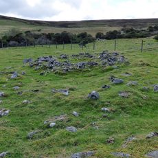 Prehistoric settlements and cairnfield, medieval farmsteads, bloomeries and charcoal pits, 840m south of Cronkley on Bracken Rig