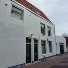 Zijgevel van het diepe hoekhuis St. Janstraat-Domusstraat