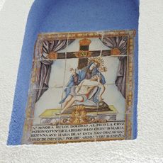 Ceramic panel of Our Lady of Sorrows at 71 Ollerías street