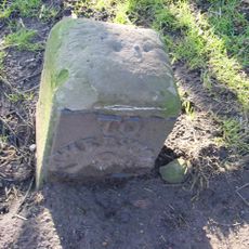 Milestone, 50m inside village from Lydney direction