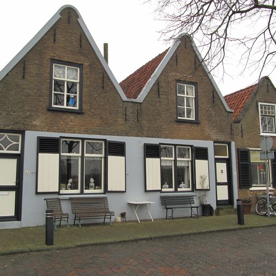 Gabled building under roll cover