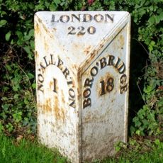 Milestone, just N of Traffic Island at A684 jct