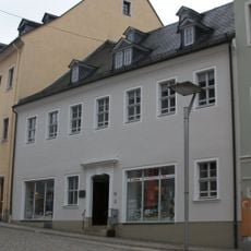 Wohnhaus in geschlossener Bebauung, mit Hofbebauung und Hintergebäude Markt 15