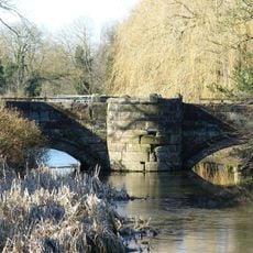 Stone bridge crossing the moat at Holford Hall