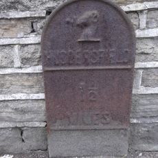 Milestone, New Hey Road, E of TI Reinwood Road/Acre Street