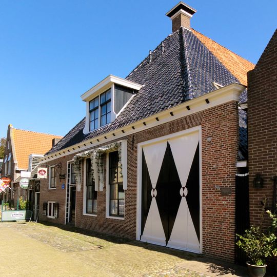 Stadsboerderij van het stelptype met zijlangsdeel