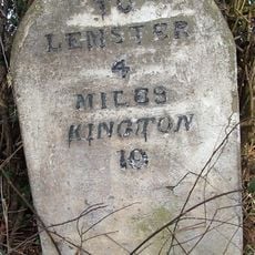 Milestone, W end of Lawton, by the village sign