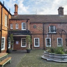 The Bush Hotel (Part Comprising The Elevation Above Ground Floor And Rear Structure In The Street Front To The Borough And The Western, Southern And Part Of The Eastern Ranges In The Yard Behind)