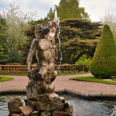 Pool wall and Triton Fountain in lower terrace garden before south front of Tatton Hall
