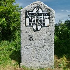 Milestone, 250m W of junction from A37 into Charminster