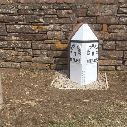 Milepost, opp. large farm yard on NW edge of village