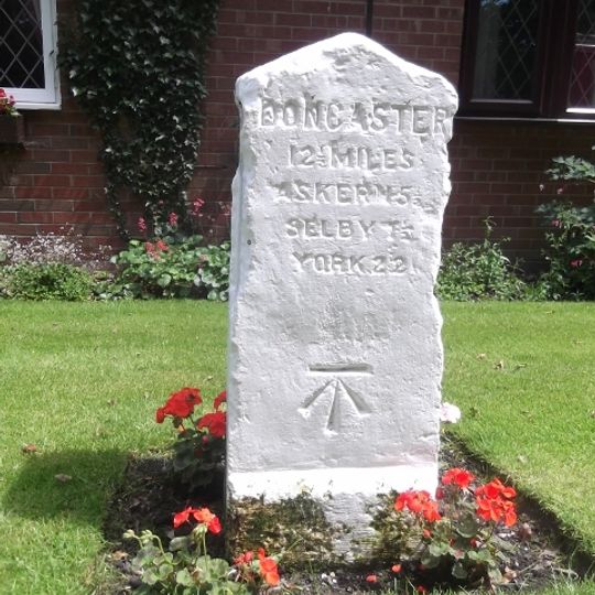 Milestone, N of M62 J34, on old road cut off by motorway
