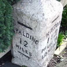 Milestone In Centre Of Village