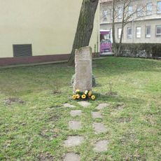 Pomník u plavecké haly v Postoloprtech