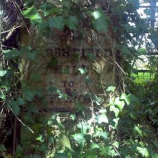 Milestone, Giddea Hall, opp. Car Park; top of bank