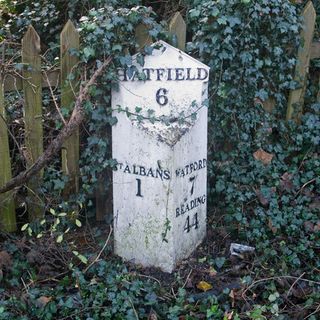 Milepost Between Numbers 10 And 12, On Opposite Side Of Road