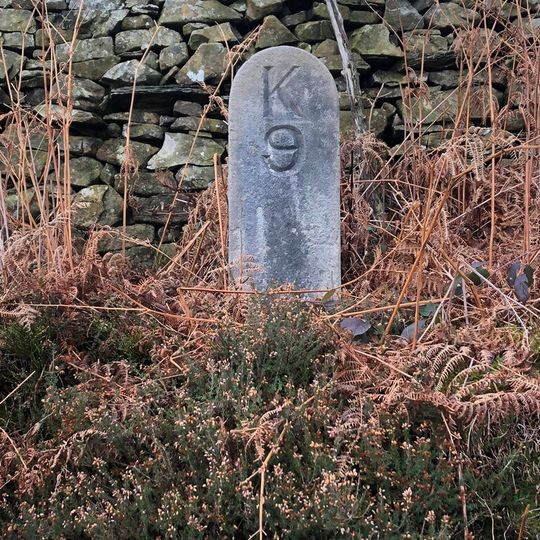 Milestone, beneath Gummer's How, just E of an entrance into the forestry