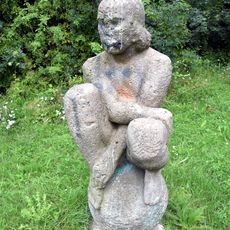 Hockende auf einer Kugel