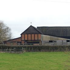 Group of two adjoining barns approximately 50 meters west of Priory Farmhouse