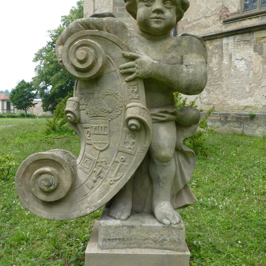 Statues of putti in front of the Holy Trinity Church in Rychnov nad Kněžnou