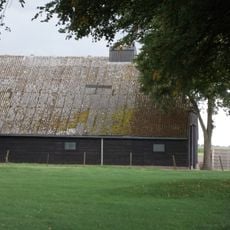 Bijschuur onder wolfsdak