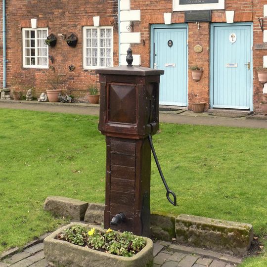 Hand Pump Approximately 10M East Of The Almshouses