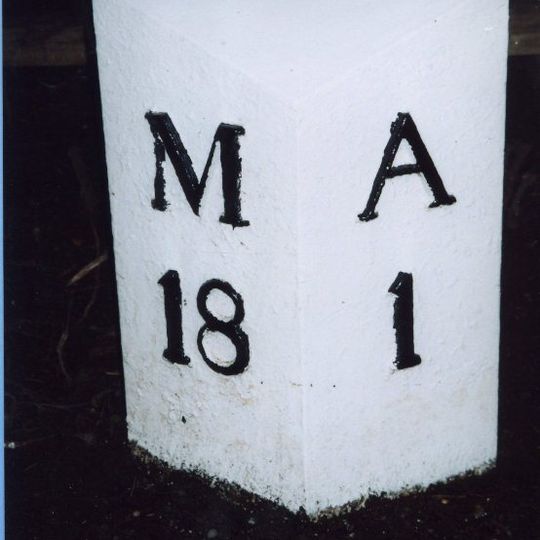 Milepost, opp. S end of the cemetery, by the bridge