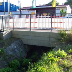 Most Pražské ulice přes Měcholupský potok