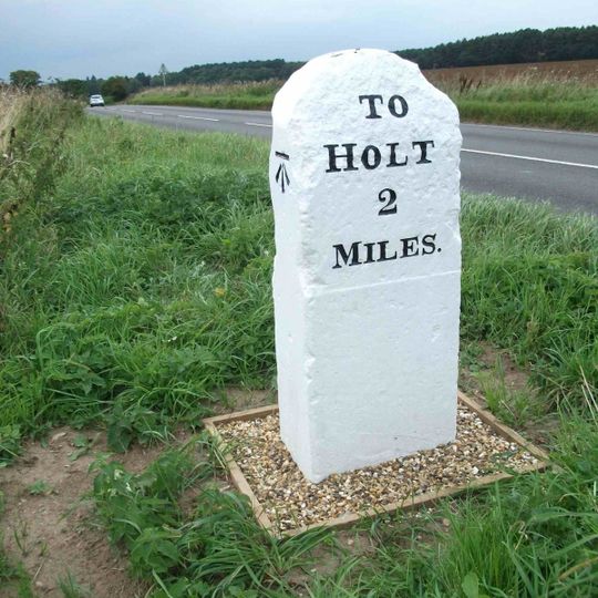 Milestone, 50yds W of junction with road to Lower Bodham