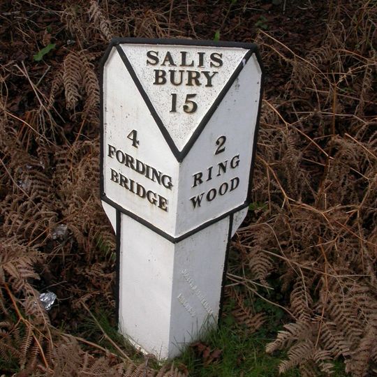 Milepost, N of entrance to gravel workings at junction of old & new roads