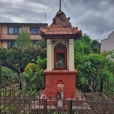 Christian wayside shrine at 43 Krakowskie Przedmieście Street in Piotrków Trybunalski