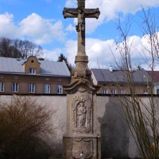 Stone cross at the Holy Trinity Church in Hostinné