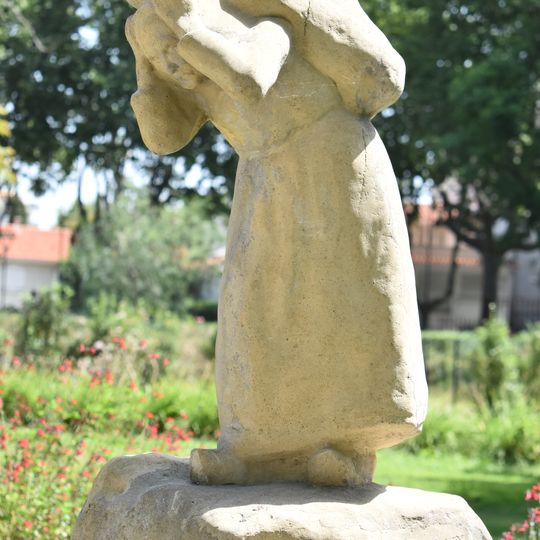 Vieille femme portant un fardeau by Célestin Manalt