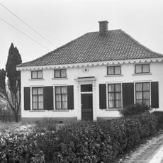 Gepleisterde boerderij op T-vormige plattegrond