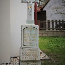 Wayside cross in Klokočí in front of a chapel