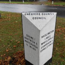 Milestone At Corner Of Narrow Lane