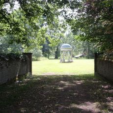 Moated site E of church